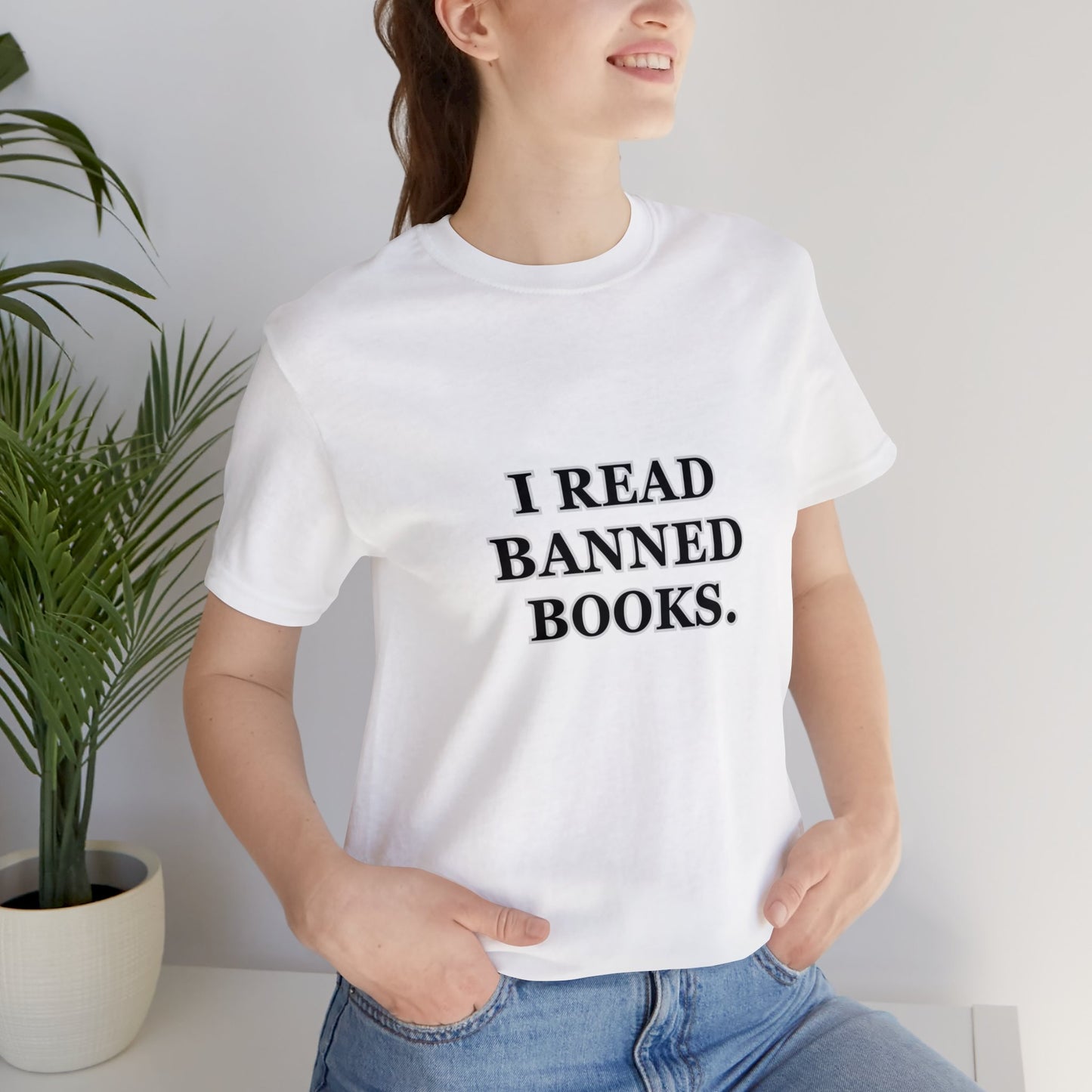 Woman wearing a white t-shirt which reads, I read Banned Books.