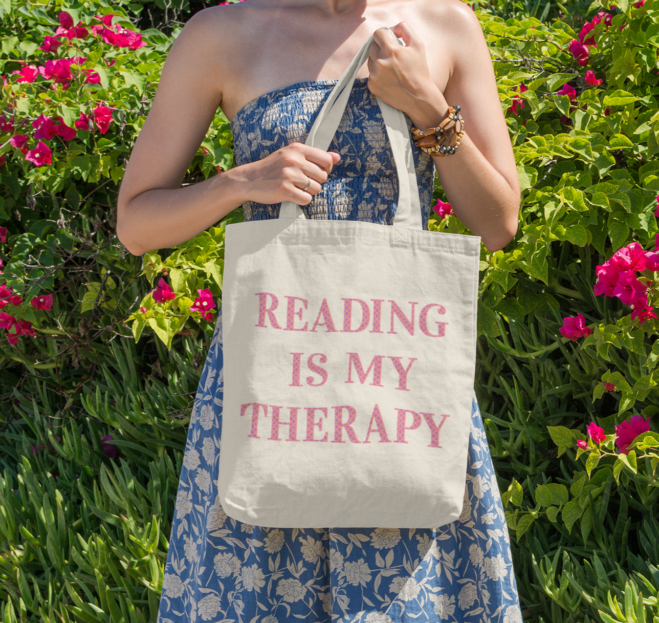 Reading Is My Therapy wording on canvas tote bag.