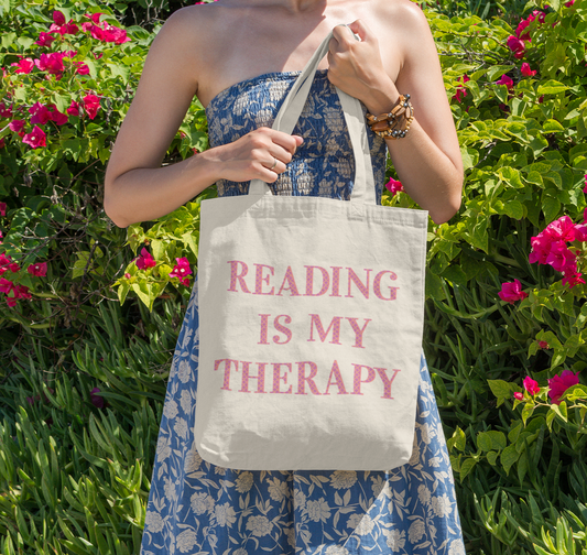 Reading Is My Therapy wording on canvas tote bag.