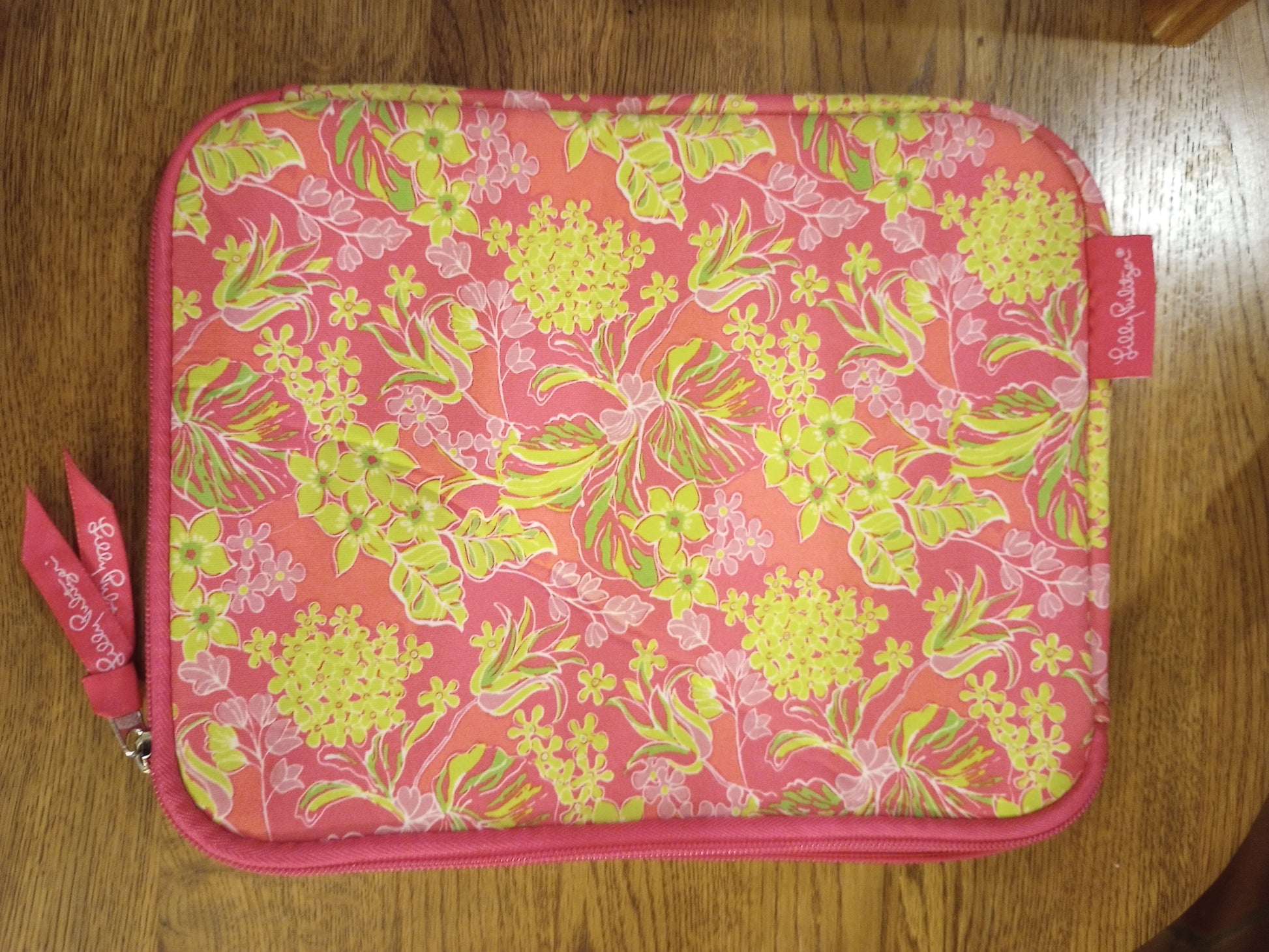  Lilly Pulitzer bag, pouch, sleeve with accessory with vivid colors and signature floral pattern.