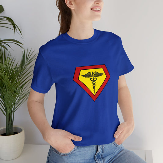 Occupation, Doctor, Medical Worker. Woman wearing a superhero style medical symbol on a t-shirt.