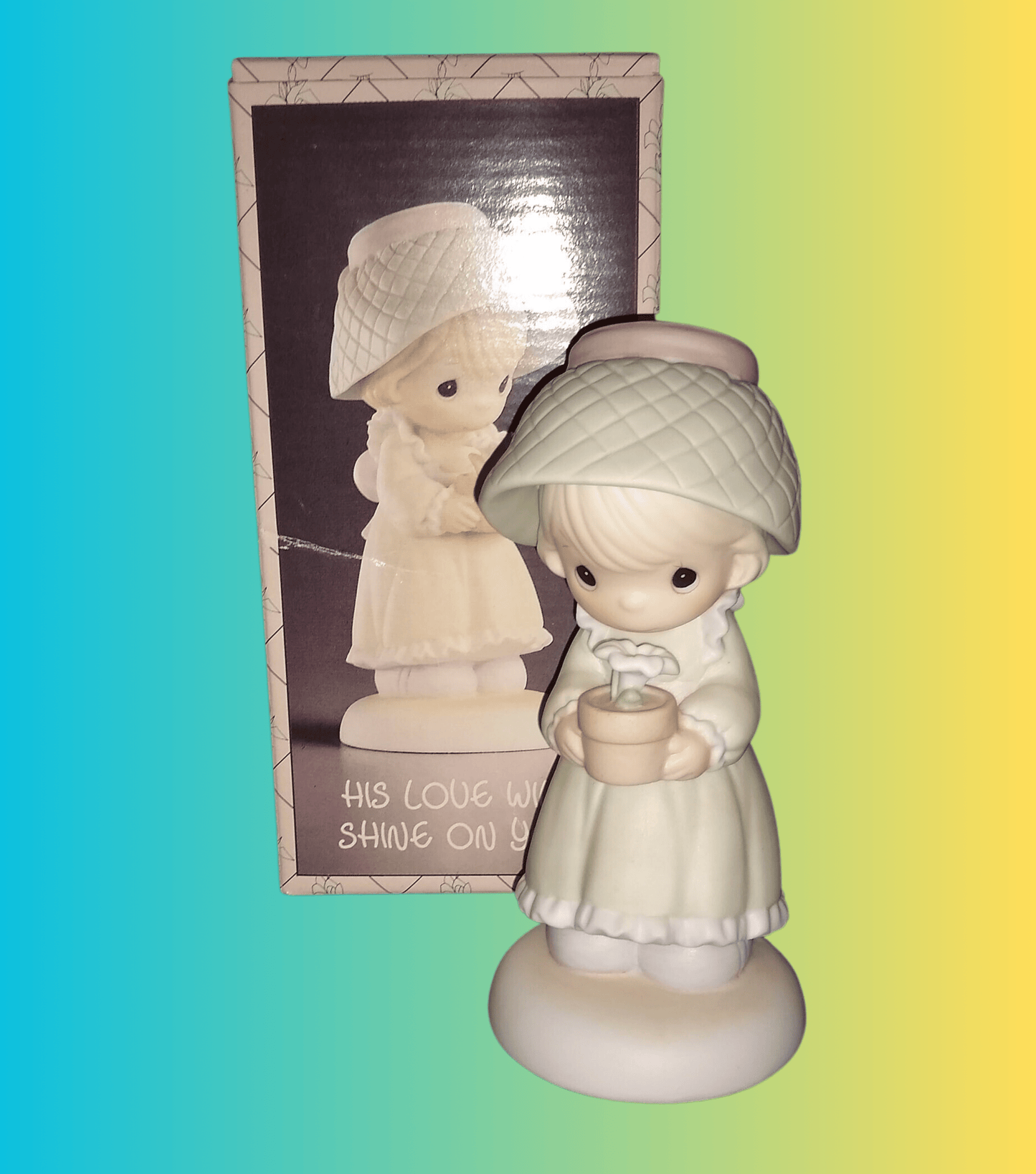Precious Moments Figurine By Enesco.  His Love Will Shine On You Figurine Featuring A Woman Holding A Flower Pot With Flowers.
