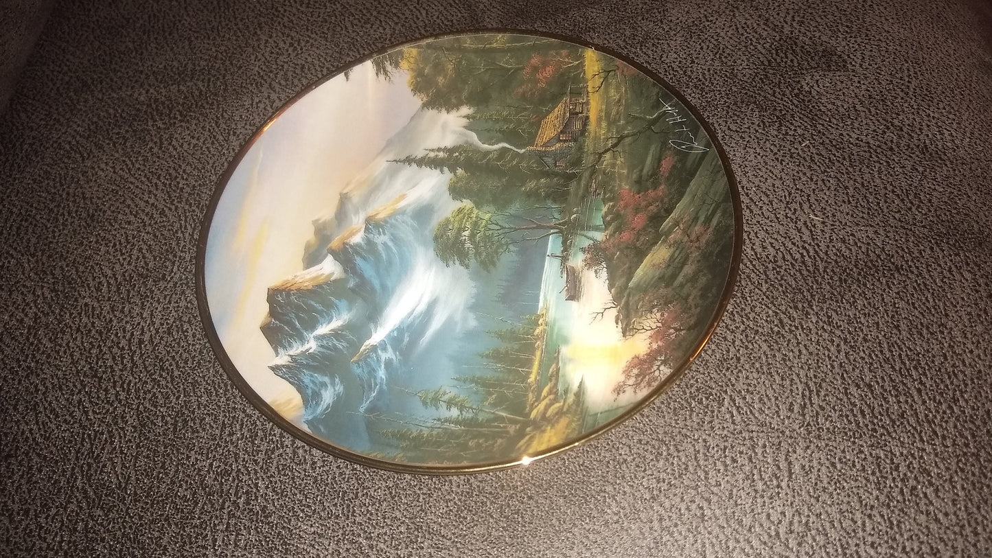 Franklin Mint Heirloom Plate. Side View Of A Plate Featuring A Mountain Retreat With Scenic Mountains In The Background. Created By Ron Huff In 1992.