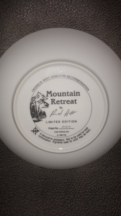 Franklin Mint Heirloom Plate. The Back Of A Plate Featuring A  Mountain Retreat  With Scenic Mountains In The Background. Created By Ron Huff In 1992.  