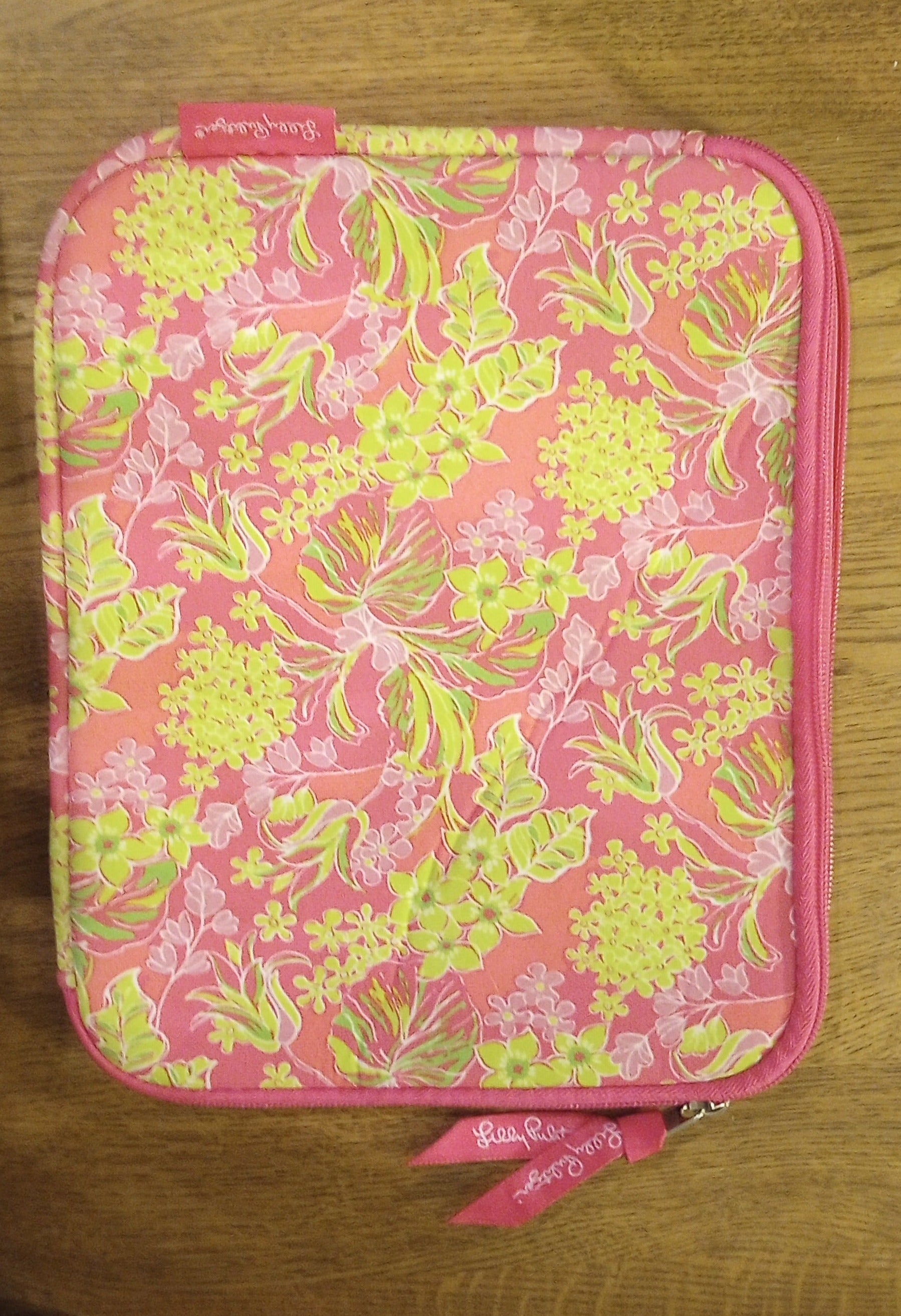  Lilly Pulitzer bag, pouch, sleeve with accessory with vivid colors and signature floral pattern.