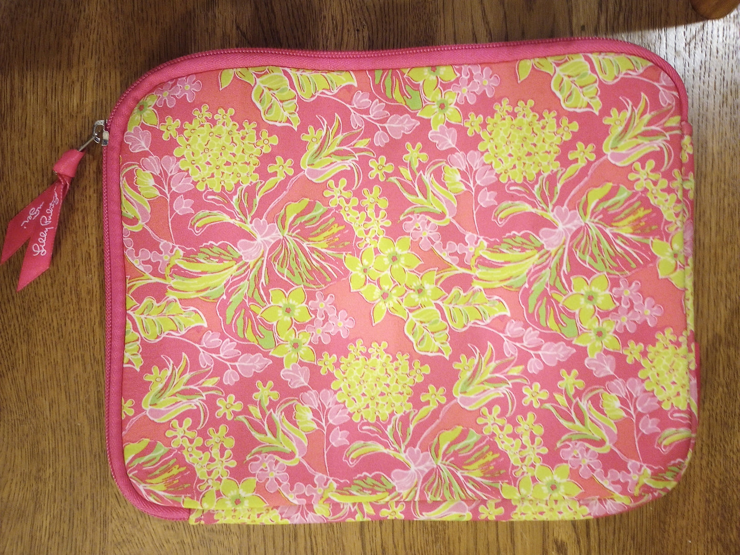  Lilly Pulitzer bag, pouch, sleeve with accessory with vivid colors and signature floral pattern.