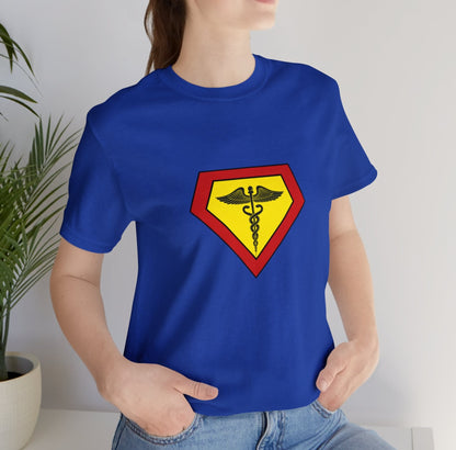 Occupation, Doctor, Medical Worker. Woman wearing a superhero style medical symbol on a t-shirt.