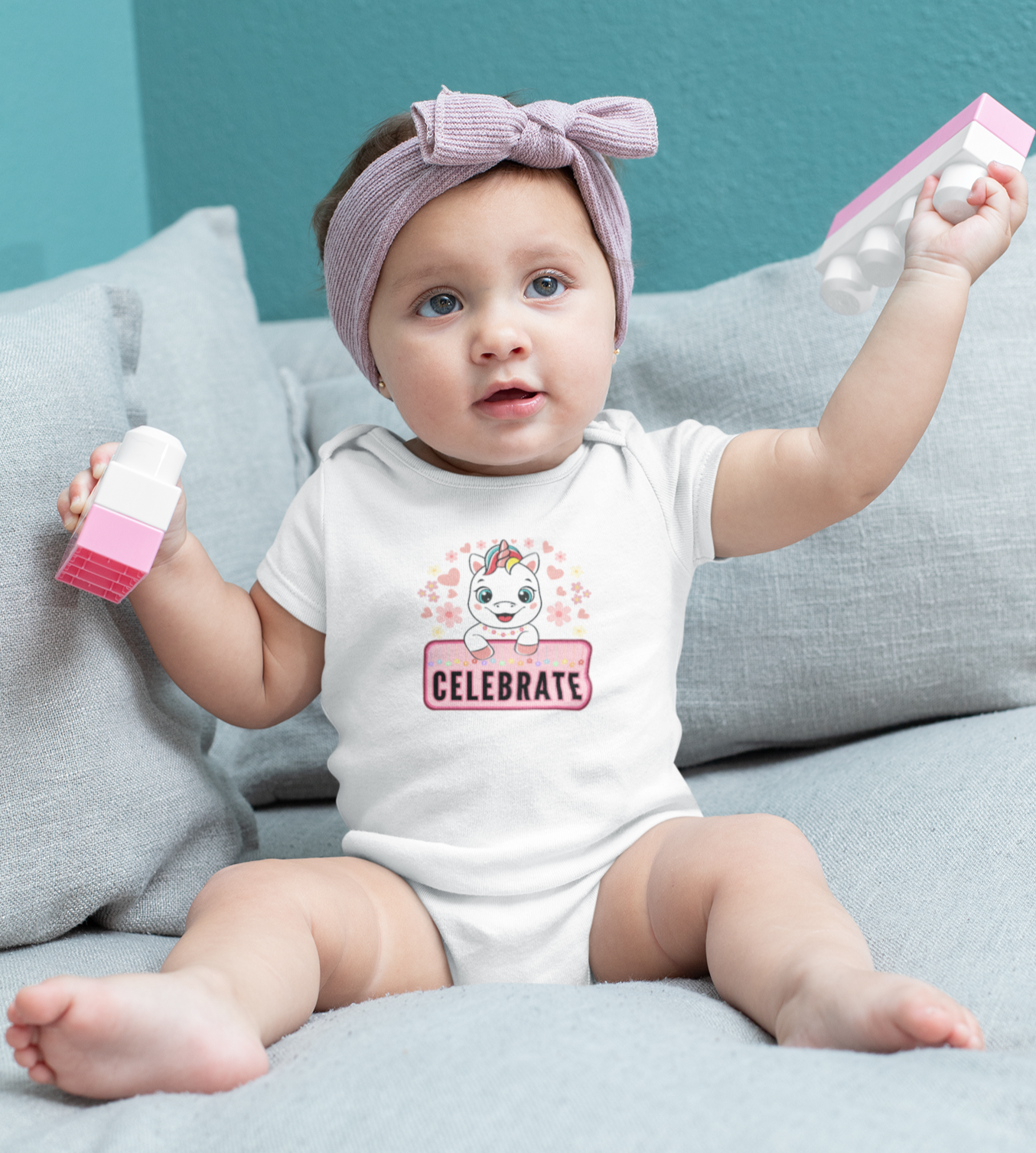 Events, Infant, Onesie. Baby wearing an event, birthday onesie with a unicorn and stars and reads, Celebrate.