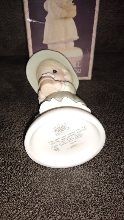 Precious Moments Figurine By Enesco.  His Love Will Shine On You Figurine Featuring A Woman Holding A Flower Pot With Flowers.