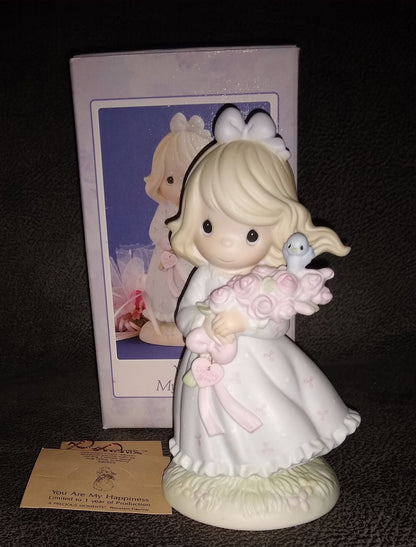 Vintage Precious Moments Figurine of A Girl Holding Roses With A Blue Bird Sitting On The Top Flower. You Are My Happiness By Enesco 1991, Last Forever collection.  